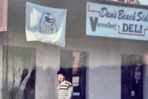 Picture of Dan Casey in front of his first restaurant Dan's Beach Side Deli
